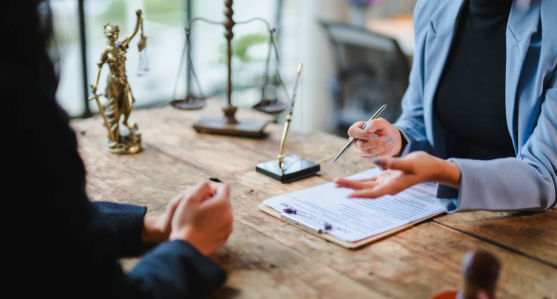 two sets of arms seemingly discussing a legal matter